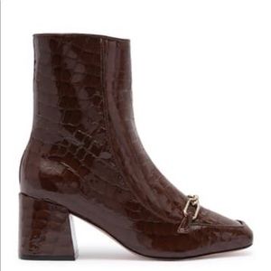 Brown Schutz booties with chain buckle
